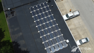 Overhead view of Keusch Glass facility with solar panels installed on the flat roof, demonstrating the company's investment in commercial renewable energy technology for long-term savings.