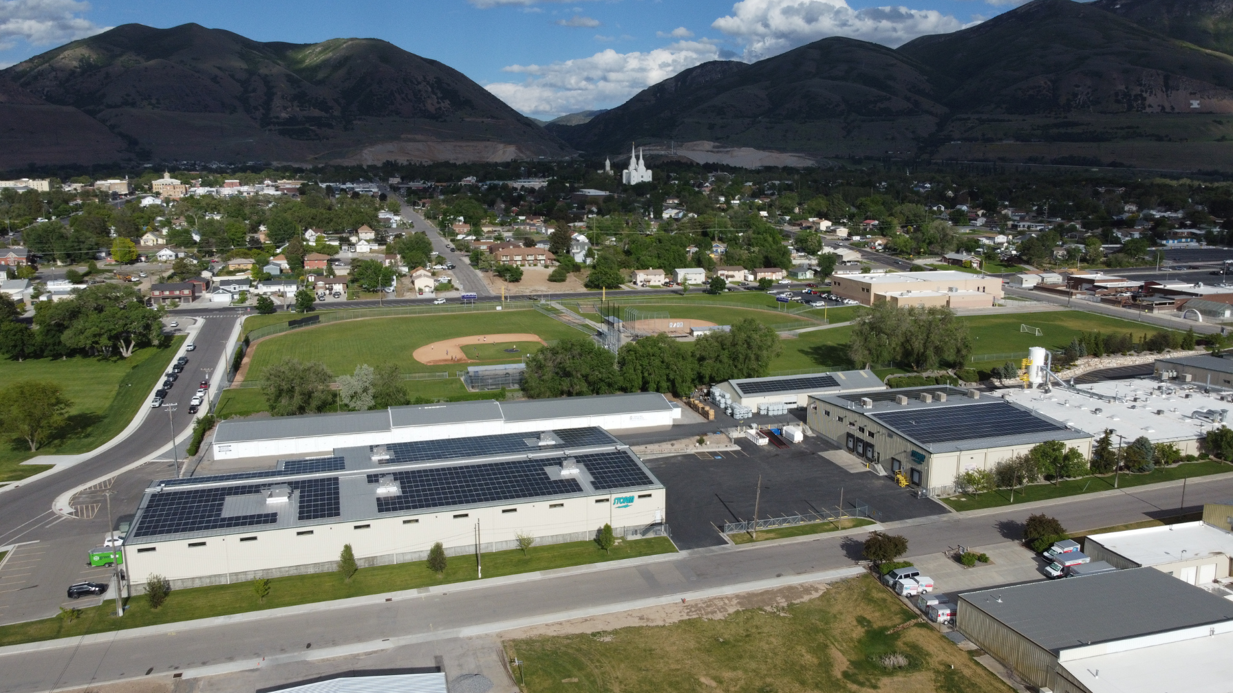 Wide aerial shot of Artisun Solar installations at Storm Products campus.