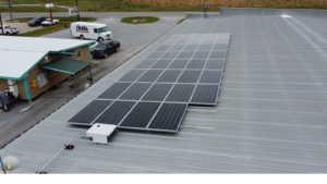 Commercial solar panel installation by Artisun Solar on the metal roof of Trahan Construction in Lake Arthur Louisiana.