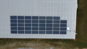 Close-up aerial of a 14 kW DC solar panel array installed by Artisun Solar for Trahan Construction in Louisiana.