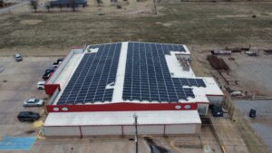 Front aerial view of 4 T's Discount Foods IGA solar array in Hennessey, OK saving $17,212 in year one.