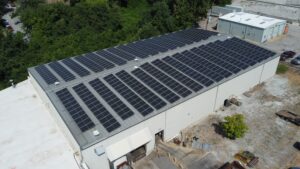 Angled aerial view of the project, showing the front and side of the facility
