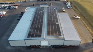 Symmetrical rooftop solar panel system designed to offset 2781 metric tons of CO2 emissions for K&J Automotive