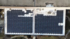 Direct overhead view of the 105.1 kW (DC) rooftop solar array installed at Preston Refrigeration.