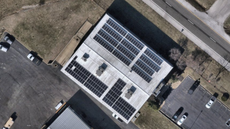 Bird's-eye top-down aerial view of the Berkeley Lumber commercial rooftop solar installation by Artisun Solar in St. Louis, Missouri.