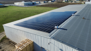 Artisun Solar commercial rooftop installation featuring 247 solar panels at Botkin Lumber, Illinois.