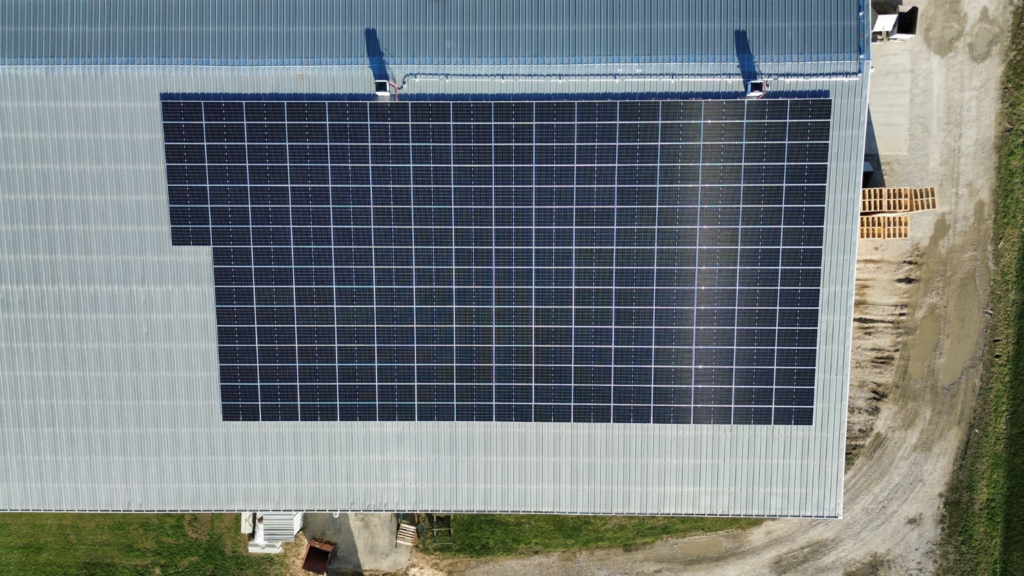 Top-down aerial view of Botkin Lumber rooftop solar panel system by Artisun Solar in Illinois.