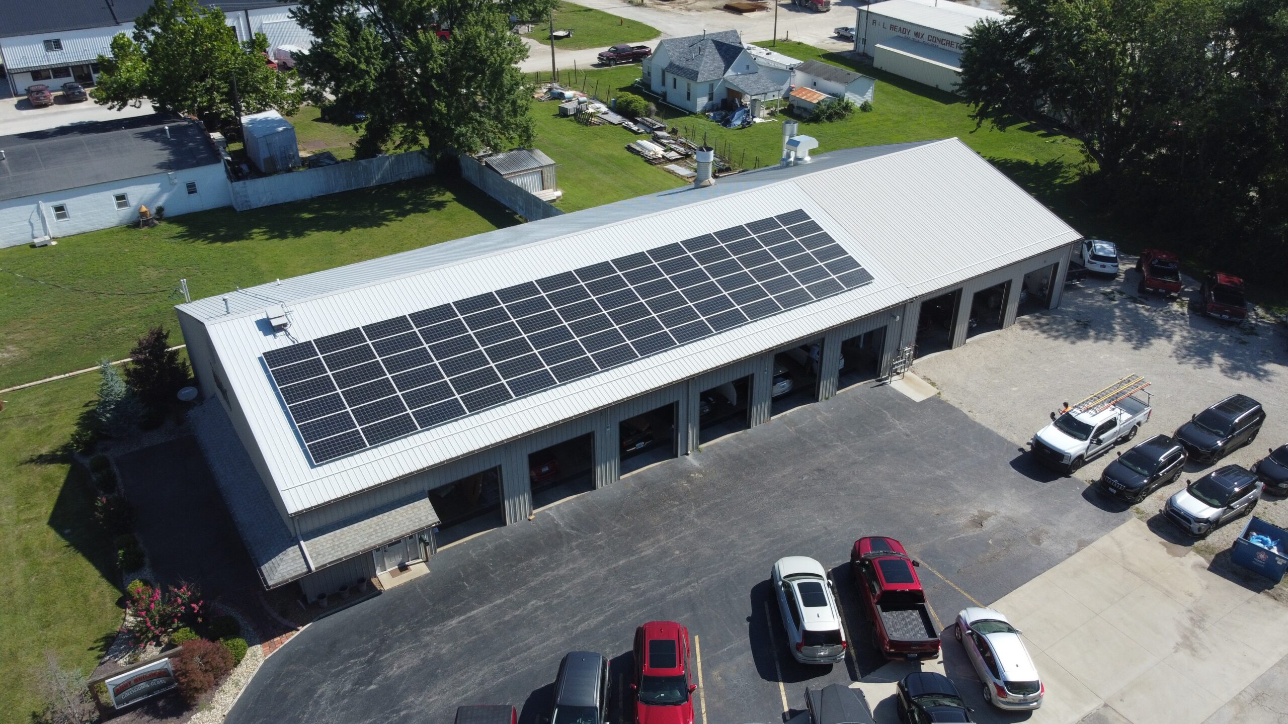 The 31.9 kW rooftop solar system at Body Builders Collision & Glass in Robinson, IL; 84 panels built to cut energy costs for the long haul.