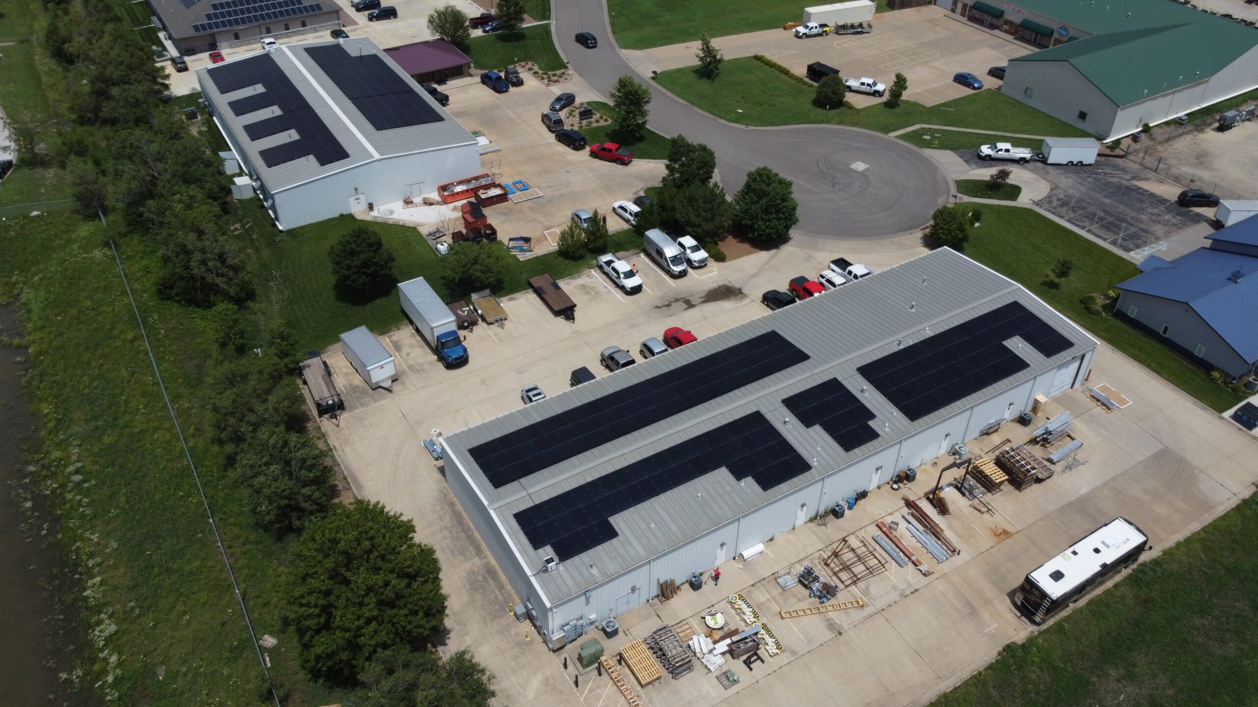 Angled corner drone view of a rooftop solar array delivering a rapid 0.8-year payback period.