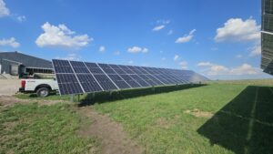 Ground-level view of Tass Pork solar array delivering 100% energy offset through Alliant Energy in Ashton, IA.