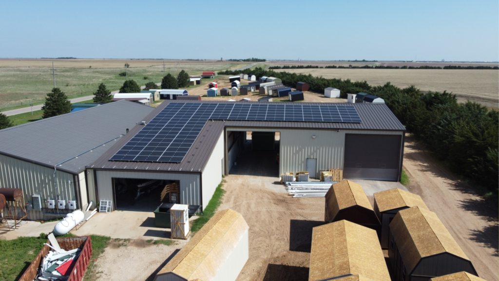 Aerial view of Greensburg Mini Barns and Premier Portable Buildings facility with rooftop solar installation by Artisun Solar.