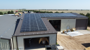 Solar panels on Greensburg Mini Barns warehouse roof, installed by Artisun Solar.