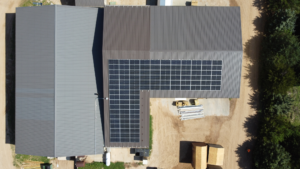 Close-up aerial shot of rooftop solar panels at Greensburg Mini Barns, installed by Artisun Solar.