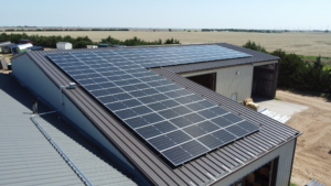 Top-down aerial view of solar panel layout on Greensburg Mini Barns building by Artisun Solar.