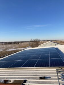 Rooftop solar installation at Cambridge Plumbing in Kirksville, MO, sized at 14.52 kW DC and mounted on a corrugated metal roof.
