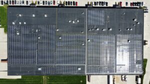 Straight-down, bird's-eye view drone photograph capturing the geometric layout of the solar panels, engineered for a 625 kW (AC) system output.