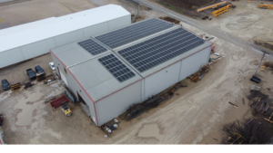 Aerial shot of the 149.7 kW rooftop solar installation by Artisun Solar at Mackey and Sons in Newton, Kansas.