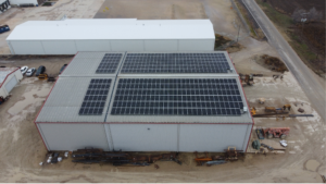Direct overhead drone view of the rooftop solar panel system installed by Artisun Solar for Mackey and Sons in Newton, Kansas.
