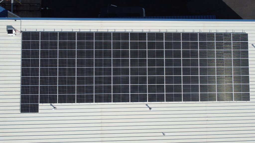 Rooftop solar array at Dri-Port Marine in O'Fallon, MO, offsetting 80.12% of facility electricity use.
