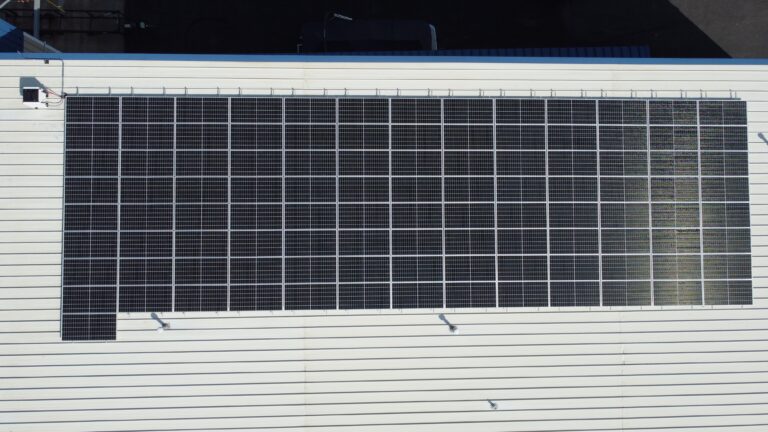 Rooftop solar array at Dri-Port Marine in O'Fallon, MO, offsetting 80.12% of facility electricity use.