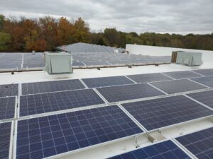 Rooftop view of Guier Fence Co. rooftop solar installation with 195 panels in Blue Springs, MO