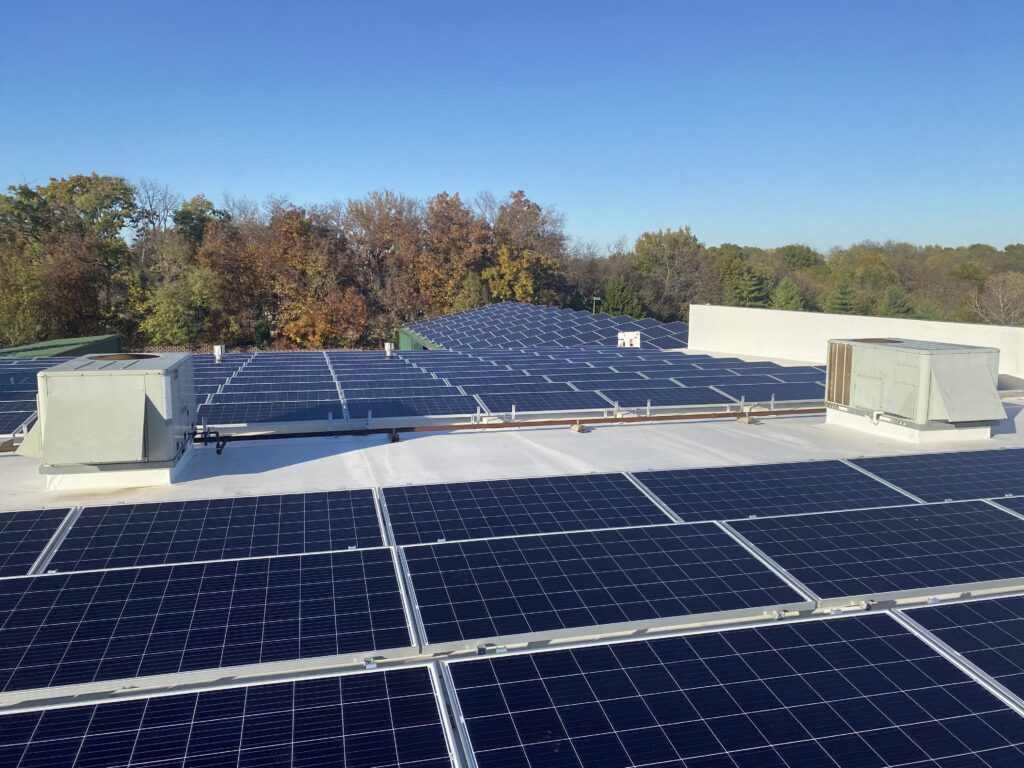 Aerial view of Guier Fence Co. commercial solar system producing 64.35 kW (AC) in Blue Springs, MO