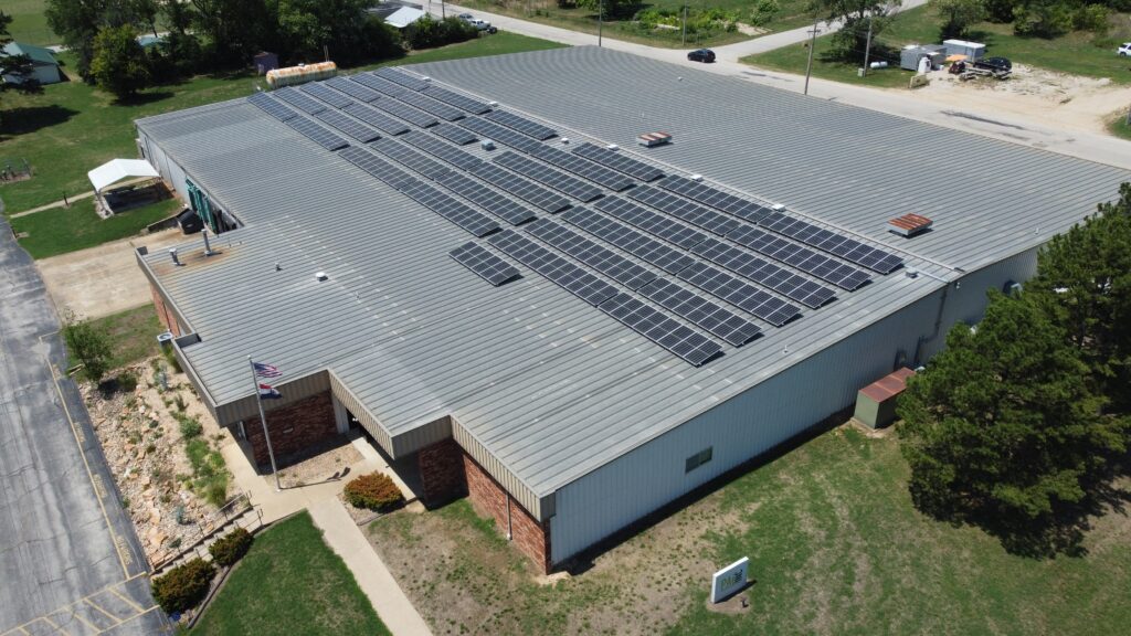 Rooftop solar array at PAI INC's Ellington, MO facility, part of a 472-panel installation.