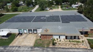 Close-up of PAI INC's Ellington rooftop solar array offsetting 4,099.2 metric tons of CO₂.